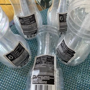 Unopened packs of plastic champagne glasses